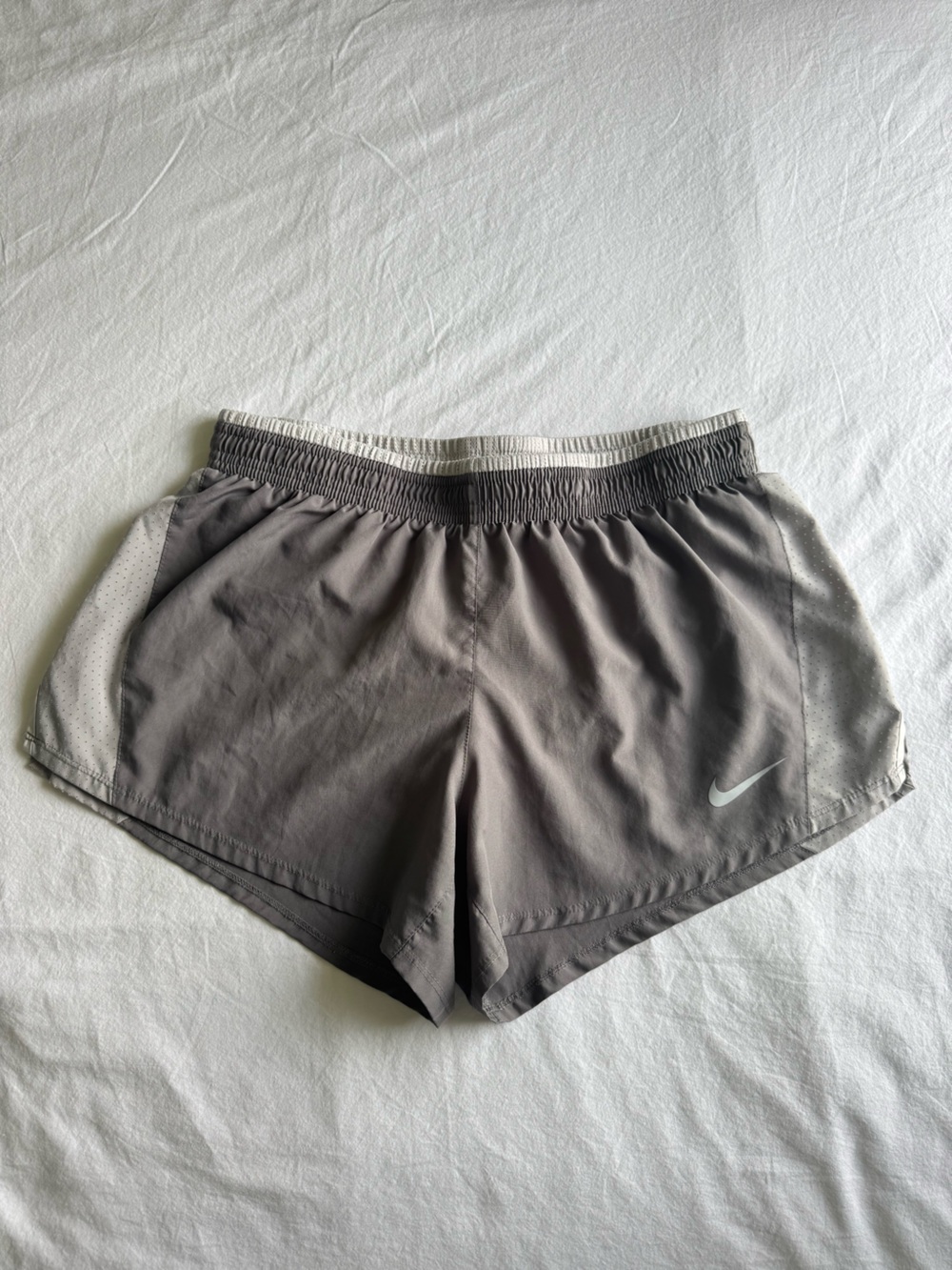 Nike Women’s Gray Performance Running Shorts with Reflective Nike symbol